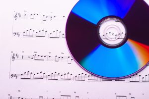 Sheet of music and CD.